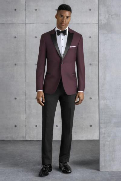 Step out in style with the Kenneth Cole Burgundy Empire tuxedo. The ultra slim fit styling is tailored to fit all body types - including big and tall sizes. The Empire is tailored in a soft, luxurious Super 120's wool fabric in a rich shade of burgundy. It features a black satin peak label and satin double besom pockets. Pair it with coordinating black ultra slim fit pants for a trim and tapered look.