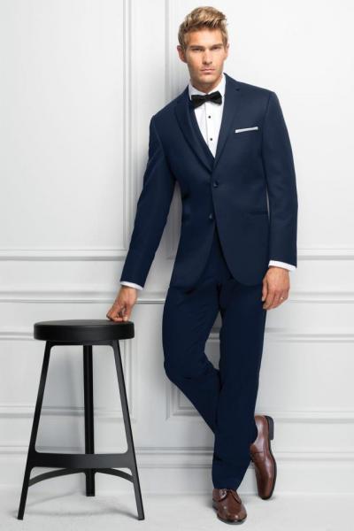 The trim and tapered fit of the Ultra Slim Fit Navy Sterling Wedding Suit fits close to the body for an updated look. It's tailored in lightweight Venetian Super 130's wool and features a self-framed notch lapel. Available with ultra slim fit pants that offer belt loops and buttons to accommodate suspenders. Also available in slim fit styling to accommodate all the members of your party.