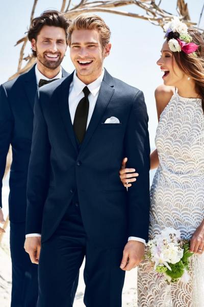A contemporary style with a flattering fit, the Navy Sterling Wedding Suit is tailored to fit all body types. Its lightweight Venetian Super 130's wool fabric gives it the most comfortable fit and feel available. Details such as the self-framed notch lapel, elegant purple satin lining and matching modern slim fit pants with an adjustable waist, belt loops and buttons to accommodate suspenders make this suit an excellent choice for your next formal affair. Pair it with a matching wool vest for a 3-piece look. Also available in ultra slim fit styling for a more trim and tapered look.